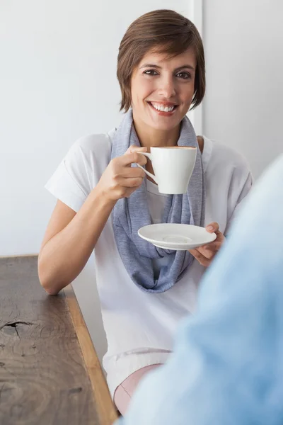 Casual woman having a coffee with friend — Stock Photo, Image
