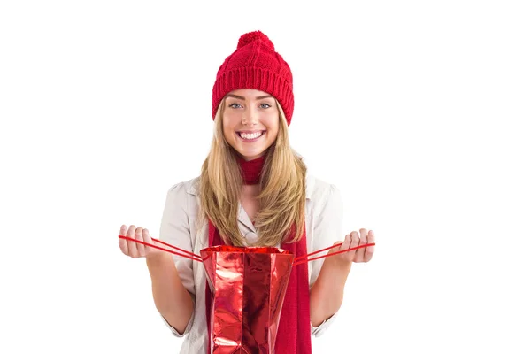 Pretty blonde opening gift bag — Stock Photo, Image