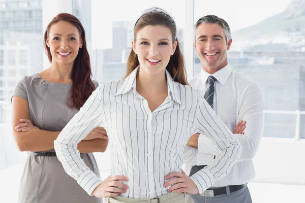 Smiling businesswoman with hand on hip — Stock Photo, Image