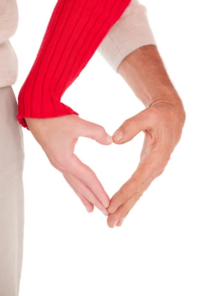 Close up of hands forming heart — Stock Photo, Image
