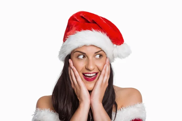 Überraschte Frau mit Weihnachtsmütze — Stockfoto