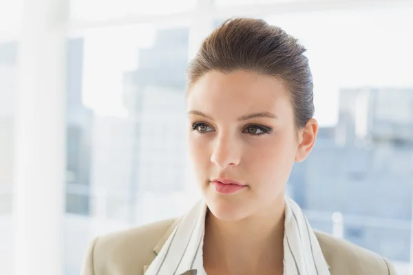 Pretty businesswoman looking and thinking — Stock Photo, Image