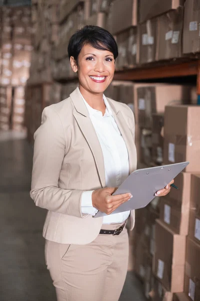 Pretty warehouse manager smiling at camera — Stock Photo, Image