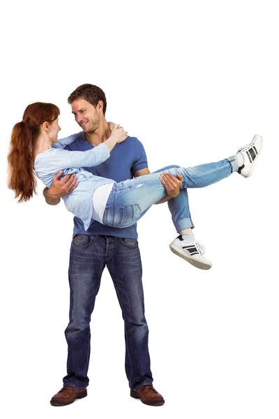 Man lifting up his girlfriend — Stock Photo, Image