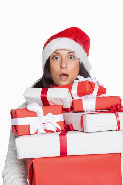 Shocked woman with christmas presents — Stock Photo, Image