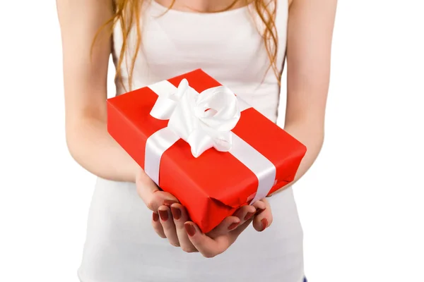 Woman holding red and white gift — Stock Photo, Image