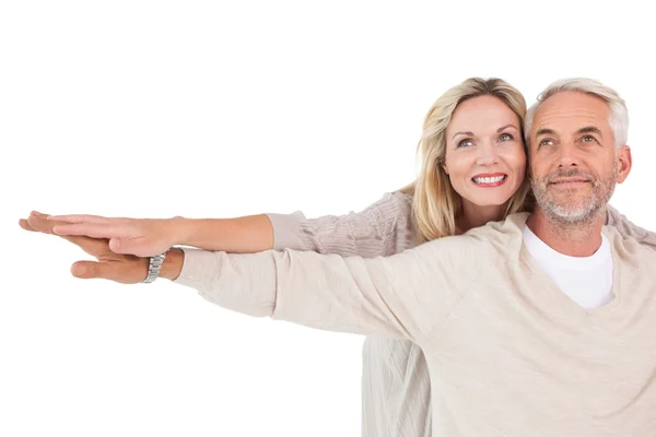 Mature couple spreading hands out — Stock Photo, Image