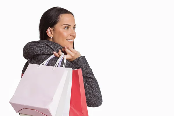 Donna sorridente che tiene la borsa della spesa — Foto Stock