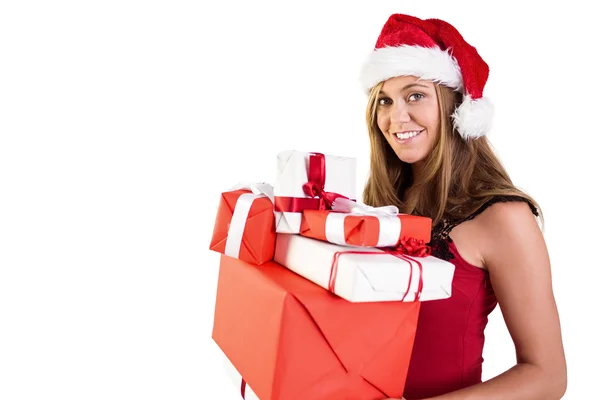Festive blonde holding pile of gifts Stock Image