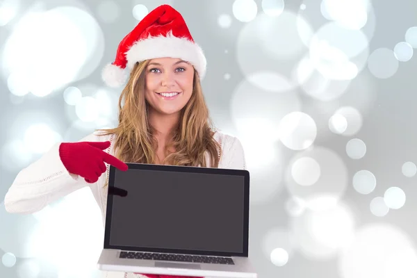 Festive blonde showing a laptop — Stock Photo, Image