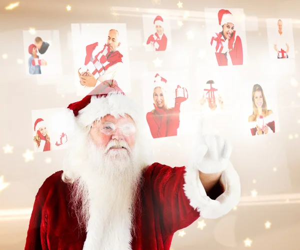 Papai Noel apontando para colagem de pessoas de Natal — Fotografia de Stock