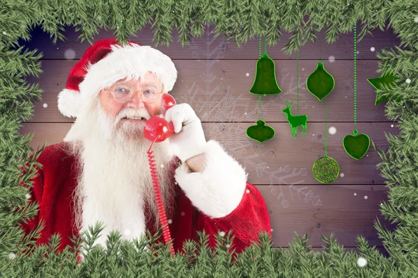 Composite image of santa claus on the phone — Stock Photo, Image