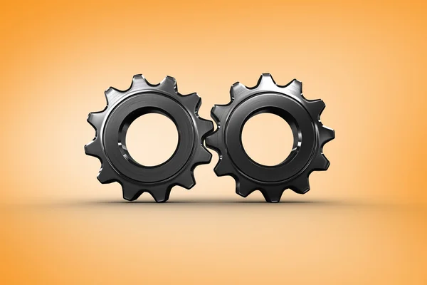 Metal cogs and wheels connecting — Stock Photo, Image