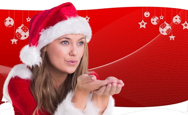 Festive blonde blowing over hands — Stock Photo, Image