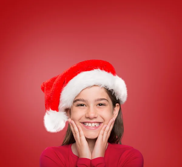 Imagem composta de menina festiva sorrindo para a câmera — Fotografia de Stock