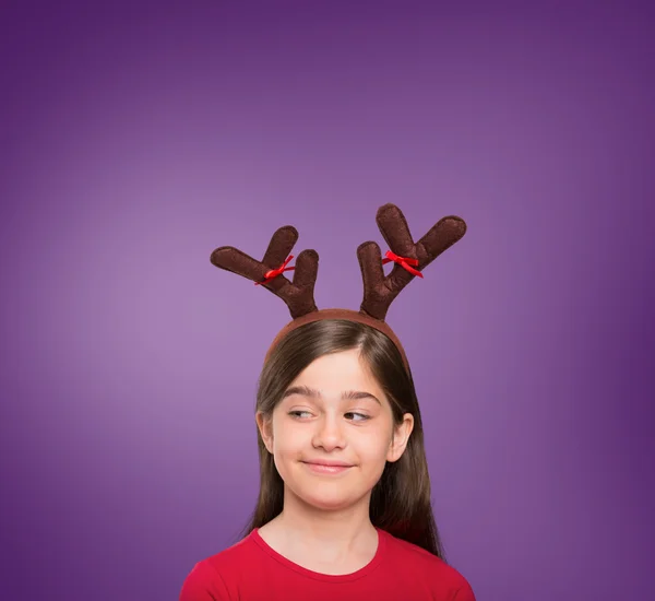 Image composite de petite fille festive portant des bois — Photo