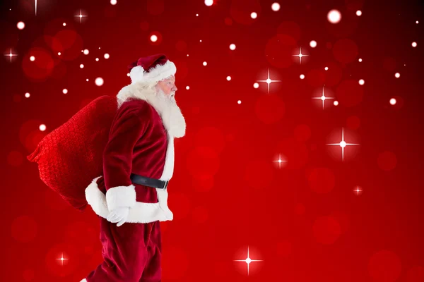 Image composite de Santa Claus portant le sac — Photo