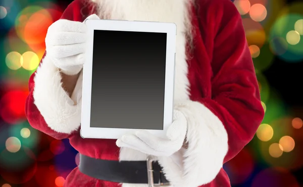 Weihnachtsmann zeigt Tablet-PC — Stockfoto