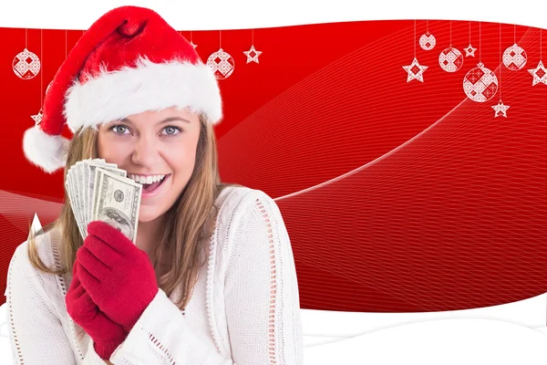 Festive blonde showing fan of dollars — Stock Photo, Image