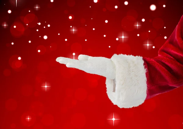 Santa Claus presenting with hand — Stock Photo, Image