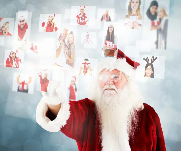 Santa, wskazując na Boże Narodzenie, które ludzie kolaż — Zdjęcie stockowe
