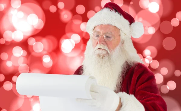 Imagem composta de santa claus verificando sua lista — Fotografia de Stock