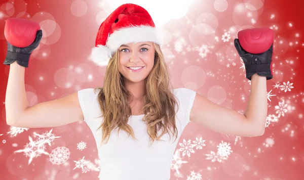 Composite image of festive blonde with boxing gloves — Stock Photo, Image