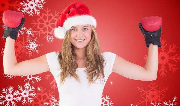 Composite image of festive blonde with boxing gloves — Stock Photo, Image