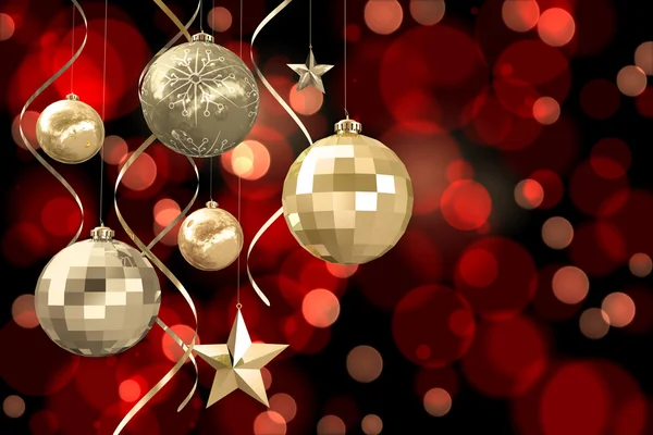 Composite image of hanging christmas bauble decorations — Stock Photo, Image