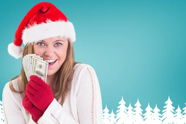 Festive blonde showing fan of dollars — Stock Photo, Image