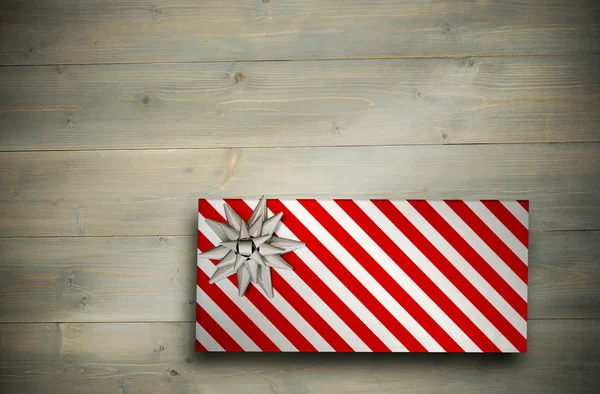 Složený obrázek vánoční dárek s lukem — Stock fotografie