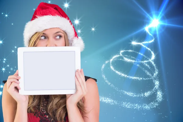 Composite image of festive blonde showing a tablet — Stock Photo, Image