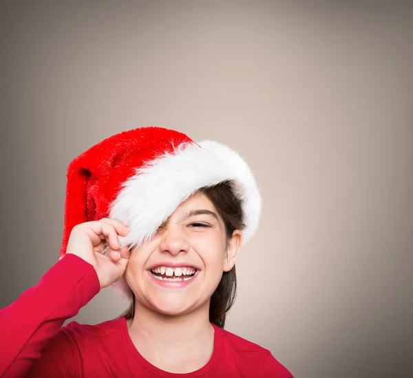 Imagem composta de menina festiva sorrindo para a câmera — Fotografia de Stock