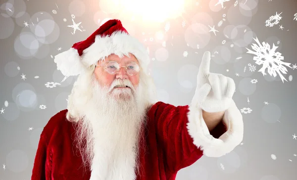 Composite image of santa claus pointing — Stock Photo, Image