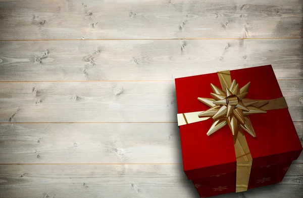 Composite image of christmas present with bow — Stock Photo, Image