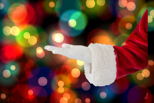 Weihnachtsmann präsentiert mit der Hand — Stockfoto