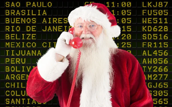 Composite image of santa claus on the phone — Stock Photo, Image