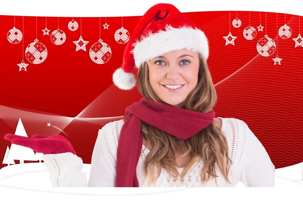 Festive blonde presenting with hand — Stock Photo, Image