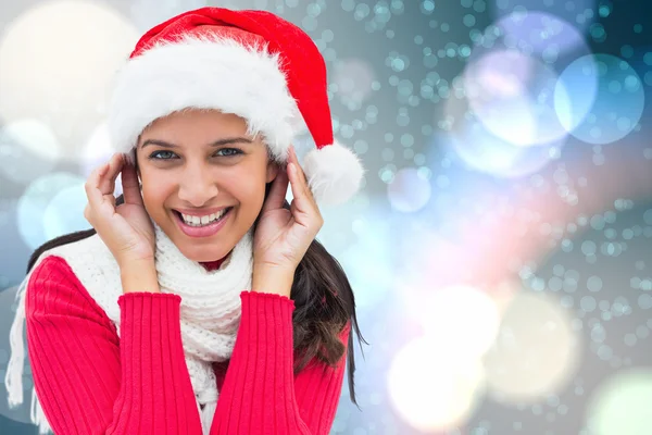 Composite image of festive brunette — Stock Photo, Image