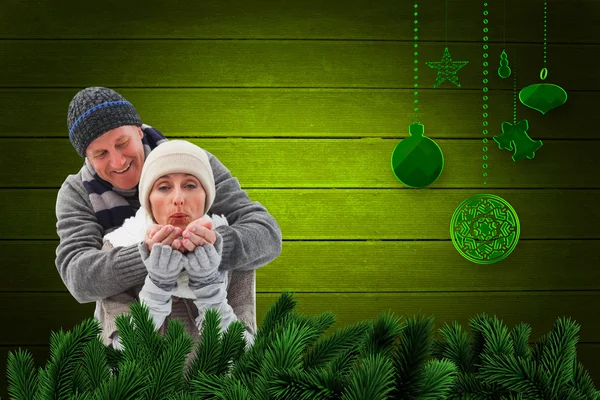 Composite image of mature winter couple — Stock Photo, Image