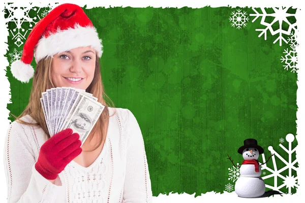 Festive blonde showing fan of dollars — Stock Photo, Image