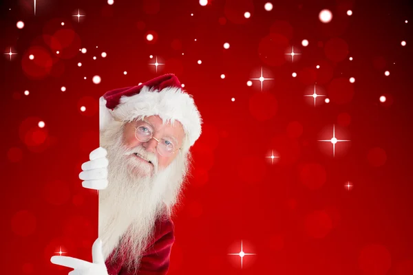 Composite image of santa claus showing — Stock Photo, Image
