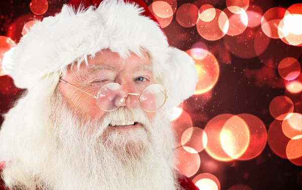 Composietbeeld van winking santa claus — Stockfoto