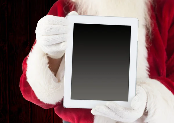 Santa claus showing tablet pc — Stock Photo, Image