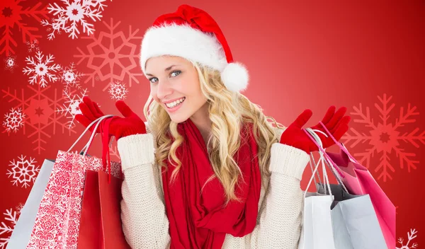 Feliz rubia festiva con bolsas de compras — Foto de Stock