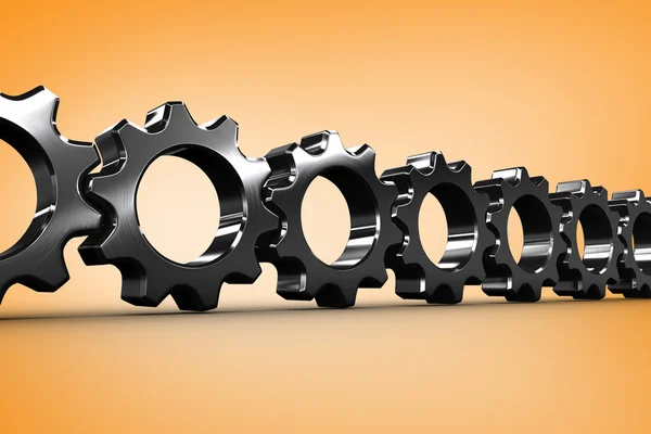 Metal cogs and wheels connecting — Stock Photo, Image