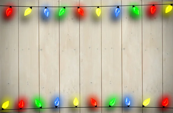 Composite image of christmas lights in a line — Stock Photo, Image