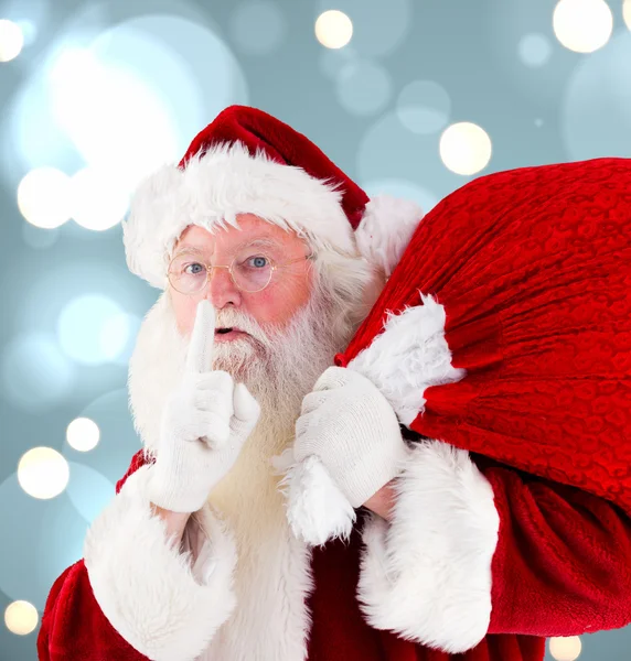 Composite image of santa claus carrying sack — Stock Photo, Image