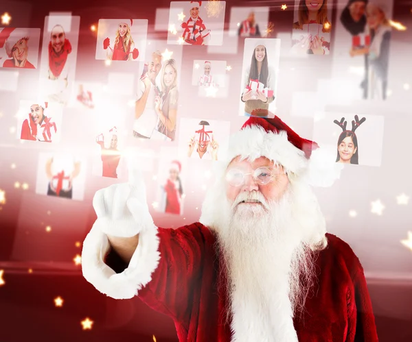 Papai Noel apontando para colagem de pessoas de Natal — Fotografia de Stock