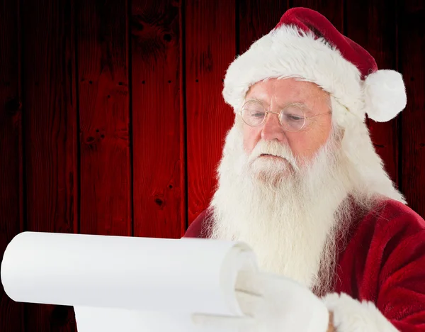 Immagine composita di Babbo Natale controllare la sua lista — Foto Stock